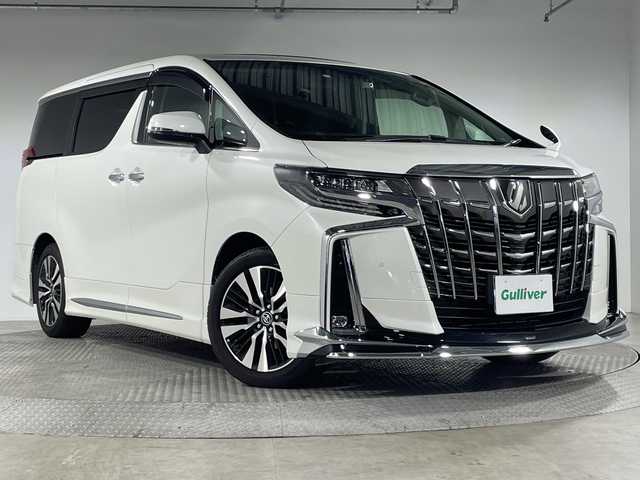 トヨタ アルファード S Cパッケージ 神奈川県 2023(令5)年 1.2万km ホワイトパールクリスタルシャイン ツインムーンルーフ/モデリスタスポイラー【フロント/サイド/リア】/モデリスタマフラー/純正9型ディスプレイオーディオ/純正フリップダウンモニター【V12T-R68C】/フルセグ　Bluetooth　/バックカメラ/両側電動スライドドア【サンシェード】/デジタルインナーミラー/パワーバックドア/セーフティセンス/レーダークルーズコントロール/プリクラッシュセーフティ/ロードサインアシスト/レーントレーシングアシスト/アダブティブハイビームシステム/ブラインドスポットモニター/リアクロストラフィックアラート/先行車発進告知/前後ソナー/nanoe/ETC/社外前方ドライブレコーダー/合皮シート/前席シートヒーター/パワーシート/ベンチレーション/助手席パワーオットマン/2列目エグゼクティブパワーシート/運転席ポジションメモリー/木目調/革巻きコンビステアリング/ステアリングヒーター/電動パーキングブレーキ/ブレーキオートホールド/プッシュスタート/スマートキー/純正18インチアルミホイール/LEDヘッド/フォグランプ/