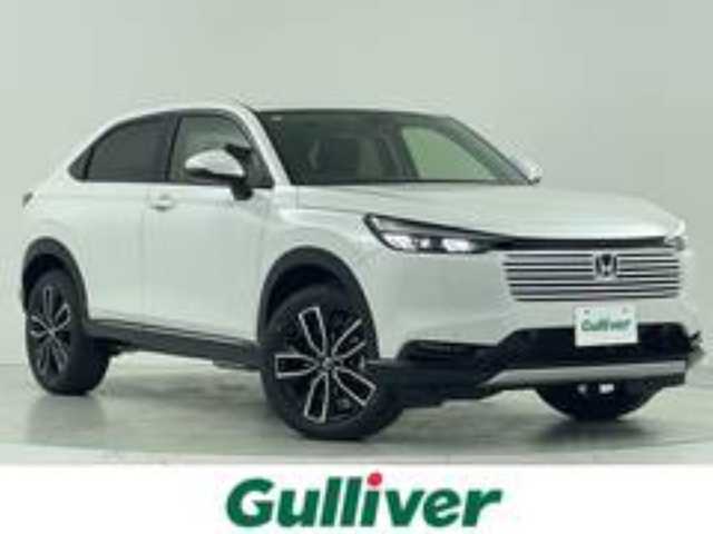 ホンダ ヴェゼル ハイブリッド e:HEV Z 大阪府 2025(令7)年 0.1千km プラチナホワイトパール ホンダセンシング/　・衝突軽減ブレーキ/　・誤発進抑制機能/　・後方誤発進抑制機能/　・歩行者事故低減ステアリング/　・路外逸脱抑制機能/　・アダプティブ・クルーズ・コントロール/　・車線維持支援システム/　・先行車発進お知らせ機能/　・標識認識機能/純正メモリナビ/　　BT/AppleCarPlay/AndroidAuto/フルセグTV/バックカメラ/パワーバックドア/LEDオートライト/フォグランプ/シートヒーター/純正18インチアルミホイール/コーナーセンサー/置くだけ充電/スマートキー/ビルトインETC2.0