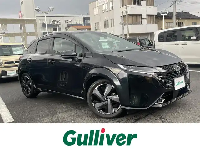 日産 オーラ G レザーエディション 島根県 2024(令6)年 1.3万km パープル ワンオーナー　/純正９型メモリナビ　/ＢＯＳＥサウンドシステム　/フルセグ/Ｂｌｕｅｔｏｏｔｈ　/全方位カメラ/ビルトインＥＴＣ2.0/前後ドラレコ　/インテリジェントクルーズコントロール　/ハーフレザーシート　/前席シートヒーター　/純正LEDライト　/前後コーナーセンサー