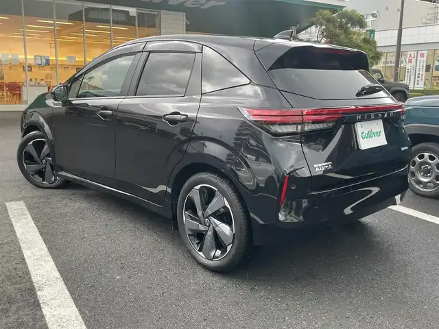 日産 オーラ G レザーエディション 島根県 2024(令6)年 1.3万km パープル ワンオーナー　/純正９型メモリナビ　/ＢＯＳＥサウンドシステム　/フルセグ/Ｂｌｕｅｔｏｏｔｈ　/全方位カメラ/ビルトインＥＴＣ2.0/前後ドラレコ　/インテリジェントクルーズコントロール　/ハーフレザーシート　/前席シートヒーター　/純正LEDライト　/前後コーナーセンサー