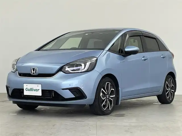 ホンダ フィット e:HEVホーム 千葉県 2020(令2)年 3万km ライトブルー 純正メモリナビ/　(CD DVD BT MSV SD USB TV)/バックカメラ/ETC/横滑り防止装置/衝突被害軽減システム/レーンキープアシスト/コーナーセンサー/追従機能付きクルーズコントロール/SOSボタン/LEDライト/ウィンカーミラー/ヘッドライトレベライザー/純正AW/ドアバイザー/電動パーキングブレーキ/オートホールドスイッチ/ステアリングスイッチ/USB端子/チップアップシート/プッシュスタート/スマートキー