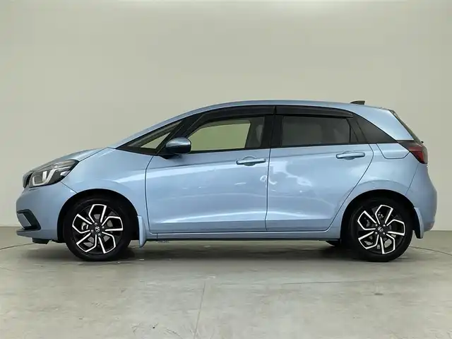 ホンダ フィット e:HEVホーム 千葉県 2020(令2)年 3万km ライトブルー 純正メモリナビ/　(CD DVD BT MSV SD USB TV)/バックカメラ/ETC/横滑り防止装置/衝突被害軽減システム/レーンキープアシスト/コーナーセンサー/追従機能付きクルーズコントロール/SOSボタン/LEDライト/ウィンカーミラー/ヘッドライトレベライザー/純正AW/ドアバイザー/電動パーキングブレーキ/オートホールドスイッチ/ステアリングスイッチ/USB端子/チップアップシート/プッシュスタート/スマートキー