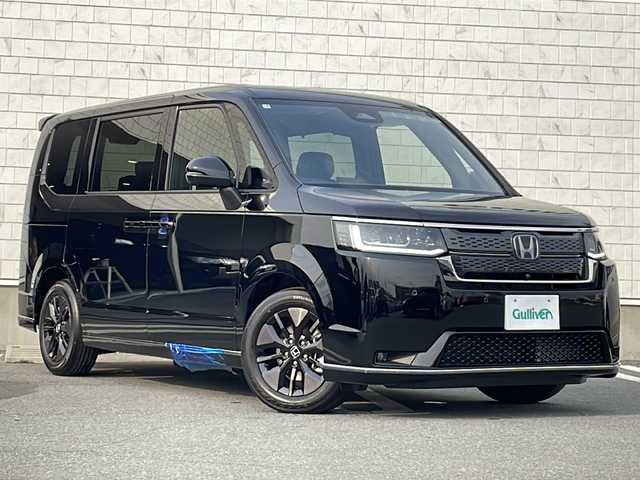 ホンダ ステップワゴン スパーダ eHEV 宮城県 2025(令7)年 0.1万km未満 クリスタルブラックパール 禁煙車/登録済み未使用車/Honda SENSING/・衝突軽減ブレーキ（ＣＭＢＳ）/・路外逸脱抑制機能/・先行車発進お知らせ機能/・アダプティブクルーズコントロール（ＡＣＣ）/・車線維持支援システム（ＬＫＡＳ）/・標識認識機能/・誤発進抑制機能 /・近距離衝突軽減ブレーキ/ブラインドスポットモニター/ハーフレザーシート/両側パワースライドドア/パドルシフト/パワーバックドア/2列目オットマン/前列USB充電ポート（タイプC）/シートヒーター/電動パーキングブレーキ/オートホールド/LEDヘッドライト/プッシュスタート/スマートキー
