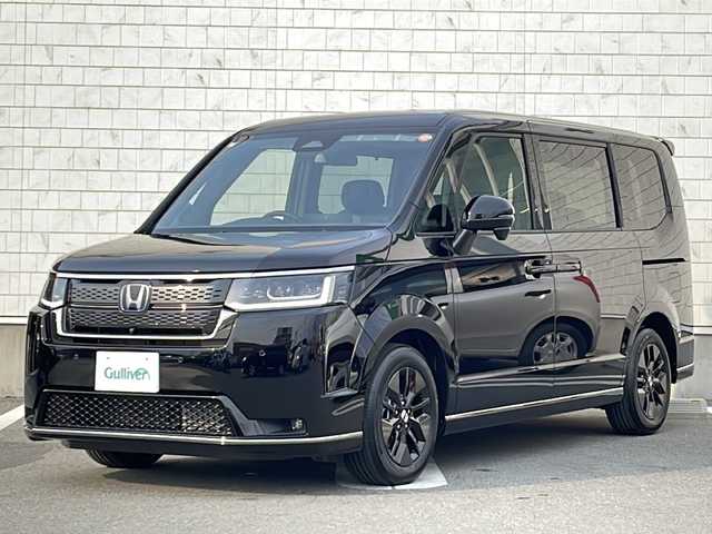ホンダ ステップワゴン スパーダ eHEV 宮城県 2025(令7)年 0.1万km未満 クリスタルブラックパール 禁煙車/登録済み未使用車/Honda SENSING/・衝突軽減ブレーキ（ＣＭＢＳ）/・路外逸脱抑制機能/・先行車発進お知らせ機能/・アダプティブクルーズコントロール（ＡＣＣ）/・車線維持支援システム（ＬＫＡＳ）/・標識認識機能/・誤発進抑制機能 /・近距離衝突軽減ブレーキ/ブラインドスポットモニター/ハーフレザーシート/両側パワースライドドア/パドルシフト/パワーバックドア/2列目オットマン/前列USB充電ポート（タイプC）/シートヒーター/電動パーキングブレーキ/オートホールド/LEDヘッドライト/プッシュスタート/スマートキー