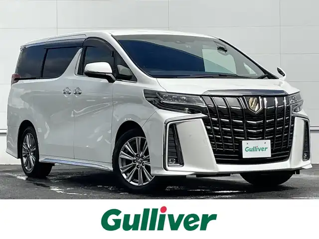 トヨタ アルファード S タイプゴールド 佐賀県 2020(令2)年 5.8万km ホワイトパールクリスタルシャイン トヨタセーフティセンス/・プリクラッシュセーフティ/・レーダークルーズコントロール/・レーンディパーチャーアラート/・オートマチックハイビーム/クリアランスソナー/PKSB/純正ディスプレイオーディオ/・T-Connectナビ/・バックカメラ/・フルセグTV/BT/CD/DVD/純正フリップダウンモニター/前後ドラレコ(ZDR-015)/純正18インチAW/両側パワースライドドア/パワーバックドア/ハーフレザーシート/キャプテンシート/オットマン/LEDヘッドライト/電動パーキングスイッチ/プッシュスタート/スペアキー×１/取扱説明書/保証書