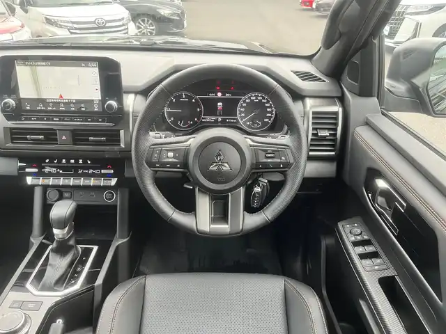 三菱 トライトン GSR 島根県 2025(令7)年 0.3万km ダイヤモンドブラックマイカ 純正メモリナビ　/Ｂｌｕｅｔｏｏｔｈ接続　/全方位／バックカメラ　/前後ドライブレコーダー　/黒革シート/運転席パワーシート/前席シートヒーター/電動トノカバー(ロールタイプ)/レーダークルーズコントロール　/衝突軽減ブレーキ　/前後コーナーセンサー　/ステアリングヒーター/スマートキー/プッシュスタート　/ＥＴＣ/純正ＬＥＤヘッドライト　/純正１８インチアルミホイール/純正フロアマット/保証書・取説・スペアキー