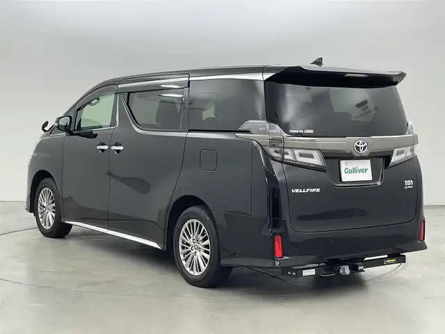 トヨタ ヴェルファイア ハイブリット ゴールデンアイズⅢ 福岡県 2022(令4)年 1.4万km ブラック 後席モニター　/純正９型ＤＡ／フルセグTV　/バックカメラ　/デジタルルームミラー　/ＥＴＣ　/トヨタセーフティセンス　/レーダークルーズコントロール　/コーナーセンサー　/衝突軽減ブレーキ　/レーンキープ　/アクセル踏み間違い防止　/ＢＳＭ　/オートマチックハイビーム　/両側電動スライドドア　/パワーバックドア　/ヒッチメンバー　/純正１７インチアルミホイール　/３眼LEDヘッドライト