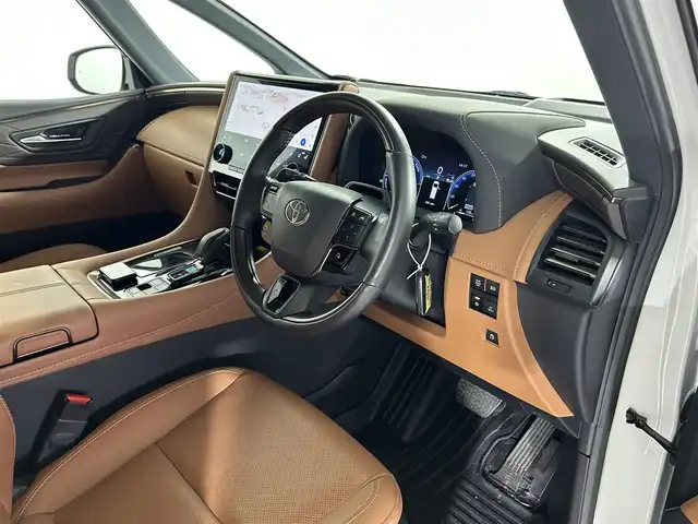 トヨタ ヴェルファイア ハイブリット Z プレミア 佐賀県 2024(令6)年 0.8万km プラチナホワイトパールマイカ 純正14インチディスプレイオーディオ/（コネクティドナビ対応）/フルセグTV/Bluetooth/MiraCast/後席13.2インチフリップダウンモニター/パノラマミックビューモニター/左右独立ムーンルーフ/両側パワースライドドア/社外デジタルインナーミラー/ETC2.0/前後ドライブレコーダー/トヨタセーフティーセンス/プリクラッシュセーフティー/アダクティブクルーズコントロール/レーントレーシングアラート/ロードサインアシスト/パーキングサポートブレーキ/トヨタチームメイト/アドバンストパーク/アドバンストドライブ/運転席・助手席パワーシート/運転席・助手席シートヒーター/運転席・助手席シートベンチレーション/運転席シートメモリ/ステアリングヒーター/三眼LEDヘッドライト/オートライト/オートハイビーム/フォグランプ/ヘッドアップディスプレイ/置くだけ充電/純正フロアマット/純正19インチアルミホイール