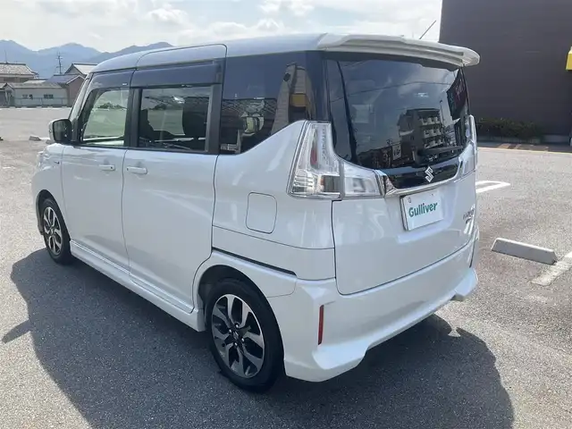 スズキ ソリオ バンディット HV MV Dカメラ ブレーキS 滋賀県 2018(平30)年 9.7万km ピュアホワイトP ワンオーナー/車検9年2月まで/スズキセーティサポート/デュアルカメラブレーキサポート/クルーズコントロール/純正8インチナビ/Bluetooth、CD、DVD、フルセグテレビ/全方位モニター、バックカメラ/ビルトインETC/両側パワースライドドア/運転席シートヒーター/LEDヘッドライト、フォグランプ/2列目パーソナルテーブル/純正15インチアルミホイール/スペアキー有り/取扱説明書、保証書/