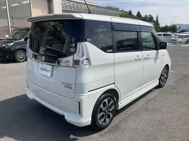 スズキ ソリオ バンディット HV MV Dカメラ ブレーキS 滋賀県 2018(平30)年 9.7万km ピュアホワイトP ワンオーナー/車検9年2月まで/スズキセーティサポート/デュアルカメラブレーキサポート/クルーズコントロール/純正8インチナビ/Bluetooth、CD、DVD、フルセグテレビ/全方位モニター、バックカメラ/ビルトインETC/両側パワースライドドア/運転席シートヒーター/LEDヘッドライト、フォグランプ/2列目パーソナルテーブル/純正15インチアルミホイール/スペアキー有り/取扱説明書、保証書/