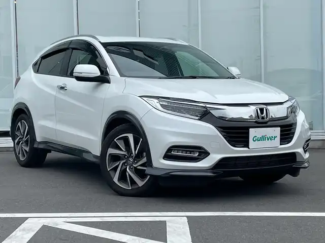 ホンダ ヴェゼル ツーリング・ホンダセンシング 神奈川県 2020(令2)年 5万km プラチナホワイトパール 純正８インチＳＤナビ（VXM-207VFEi）/ワンセグ/Bluetooth/CD/DVD/iPod/USB/追従式クルーズコントロール/前席シートヒーター/パドルシフト/LEDヘッドライト/純正アルミホイール/純正フロアマット/ブレーキホールド/レーンキープアシスト/横滑り防止装置/電動格納ミラー/ドアバイザー/衝突被害軽減システム/カーテンエアバック