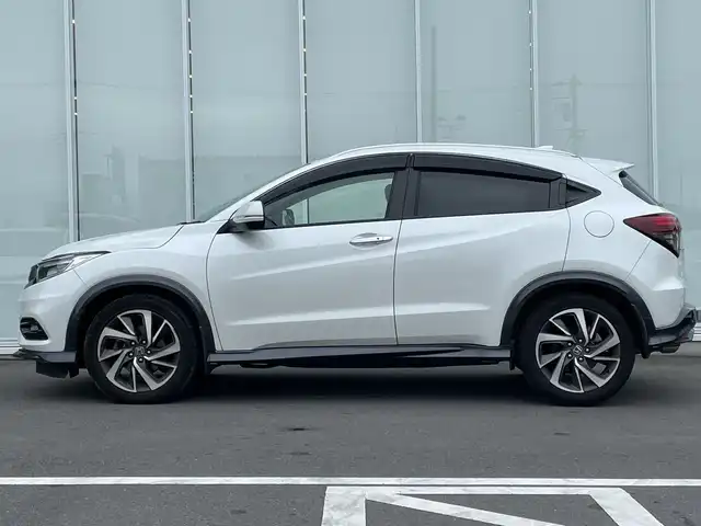 ホンダ ヴェゼル ツーリング・ホンダセンシング 神奈川県 2020(令2)年 5万km プラチナホワイトパール 純正８インチＳＤナビ（VXM-207VFEi）/ワンセグ/Bluetooth/CD/DVD/iPod/USB/追従式クルーズコントロール/前席シートヒーター/パドルシフト/LEDヘッドライト/純正アルミホイール/純正フロアマット/ブレーキホールド/レーンキープアシスト/横滑り防止装置/電動格納ミラー/ドアバイザー/衝突被害軽減システム/カーテンエアバック