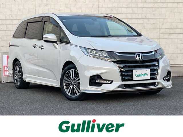 ホンダ オデッセイ ハイブリッド アブソルート・EXホンダセンジング 山口県 2018(平30)年 1.9万km プラチナホワイトパール 純正ディーラーOPナビ/（SD/フルセグ/DISC/USB/iPod/BT/ラジオ）/Apple Car Play/全方位カメラ/ハーフレザーシート/シートヒーター/エンジンスターター/前後ドライブレコーダー/ビルトインETC2.0/レーダークルーズコントロール/ブラインドスポットモニター/D/N席パワーシート/両側電動スライドドア/リヤオートエアコン/オートブレーキホールド/ドアバイザー/フォグライト/純正フロアマット/LEDヘッドライト