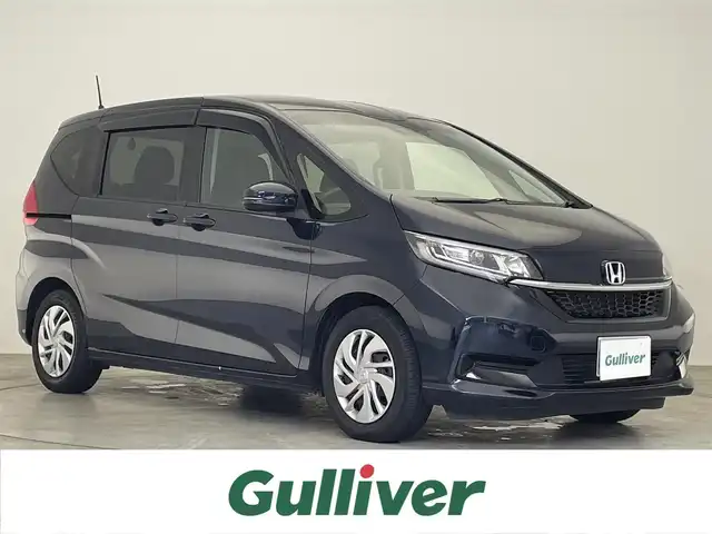 ホンダ フリード G ホンダセンシング 滋賀県 2020(令2)年 2.7万km ミッドナイトブルービームM 禁煙車/純正９型ナビ/（CD/DVD/SD/USB/Bluetooth/フルセグTV）/バックカメラ/ビルトインETC/両側電動スライドドア/路外逸脱抑制システム/レーンキープアシストシステム/衝突被害軽減システム/標識認識機能/アダプティブクルーズコントロール/ステアリングリモコン/シートヒーター/LEDヘッドライト/オートヘッドライト/フロント熱線/純正フロアマット/オートリトラーミラー/リアロールサンシェイド/スマートキー