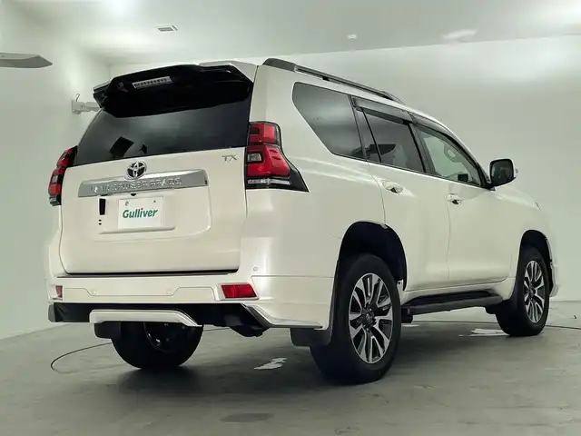 トヨタ ランドクルーザー プラド TX Lパッケージ 福島県 2023(令5)年 1.6万km ホワイトパールクリスタルシャイン 7人乗り/寒冷地仕様/モデリスタエアロ/サンルーフ/ルーフレール/純正OP19インチアルミホイール/純正9インチナビ(CD/DVD/Bluetooth/フルセグTV)/バックカメラ/前後ドライブレコーダー/ベージュレザーシート/前席パワーシート/前席シートヒーター/前席シートベンチレーション/トヨタセーフティーセンス/前後コーナーセンサー/ビルトインETC2.0/スペアキー×1/新車時保証書＆取扱説明書