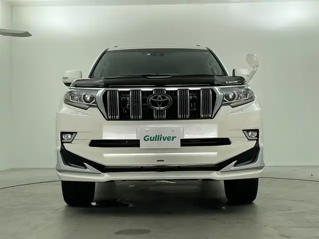 トヨタ ランドクルーザー プラド TX Lパッケージ 福島県 2023(令5)年 1.6万km ホワイトパールクリスタルシャイン 7人乗り/寒冷地仕様/モデリスタエアロ/サンルーフ/ルーフレール/純正OP19インチアルミホイール/純正9インチナビ(CD/DVD/Bluetooth/フルセグTV)/バックカメラ/前後ドライブレコーダー/ベージュレザーシート/前席パワーシート/前席シートヒーター/前席シートベンチレーション/トヨタセーフティーセンス/前後コーナーセンサー/ビルトインETC2.0/スペアキー×1/新車時保証書＆取扱説明書