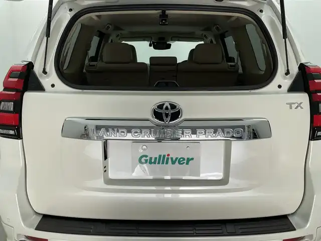 トヨタ ランドクルーザー プラド TX Lパッケージ 福島県 2023(令5)年 1.6万km ホワイトパールクリスタルシャイン 7人乗り/寒冷地仕様/モデリスタエアロ/サンルーフ/ルーフレール/純正OP19インチアルミホイール/純正9インチナビ(CD/DVD/Bluetooth/フルセグTV)/バックカメラ/前後ドライブレコーダー/ベージュレザーシート/前席パワーシート/前席シートヒーター/前席シートベンチレーション/トヨタセーフティーセンス/前後コーナーセンサー/ビルトインETC2.0/スペアキー×1/新車時保証書＆取扱説明書