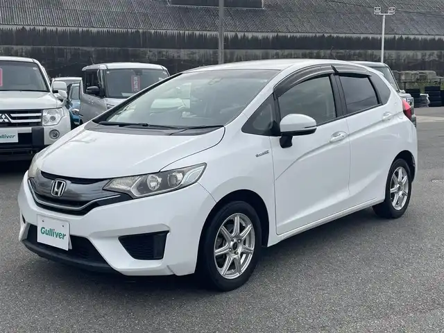 ホンダ フィット ハイブリット Lパッケージ 山形県 2015(平27)年 10.5万km ホワイトオーキッドパール 衝突軽減/メモリナビ/　【 CD　DVD　フルセグ　BT　AM・FM】/バックカメラ/クルーズコントロール/LEDオートライト/ハーフレザーシート/15インチアルミホイール/ステアリングスイッチ/電動格納ウィンカーミラー/純正フロアマット/ドアバイザー/スマートキー/ETC