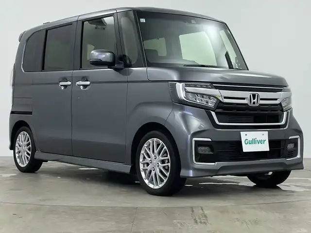 ホンダ Ｎ ＢＯＸ カスタム L ターボ 鹿児島県 2021(令3)年 1.8万km シャイニンググレーM 純正8型ナビ/（AM/FM/CD/DVD/Bluetooth/フルセグ）/バックカメラ/両側パワースライドドア/ホンダセンシング/レーダークルーズコントロール/レーンキープアシスト/オートライト/オートハイビーム/前後ドライブレコーダー/パドルシフト/ハーフレザーシート/シートヒーター/ETC/LEDヘッドライト/スマートキー/純正フロアマット