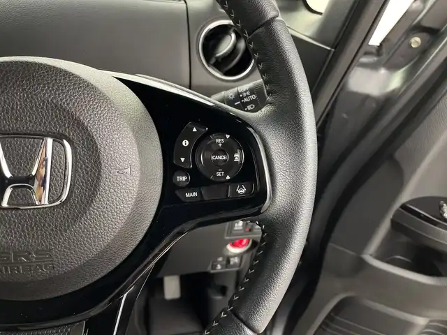 ホンダ Ｎ ＢＯＸ カスタム L ターボ 鹿児島県 2021(令3)年 1.8万km シャイニンググレーM 純正8型ナビ/（AM/FM/CD/DVD/Bluetooth/フルセグ）/バックカメラ/両側パワースライドドア/ホンダセンシング/レーダークルーズコントロール/レーンキープアシスト/オートライト/オートハイビーム/前後ドライブレコーダー/パドルシフト/ハーフレザーシート/シートヒーター/ETC/LEDヘッドライト/スマートキー/純正フロアマット