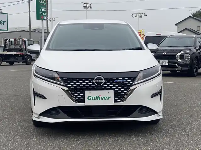日産 ノート オーテック FOUR 青森県 2022(令4)年 1.3万km ピュアホワイトパール ワンオーナー/４WD/純正メモリナビ/（BT／AM／FM／DVD）/純正エアロ/全周囲方位カメラ/黒レザーシート（AUTCH）/シートヒーター（運転席＋助手席）/ステアリングスイッチ/ステアリングヒーター/LEDヘッドライト/オートマチックハイビーム/ビルトインETC/ドライブレコーダー（前後）/デジタルルームミラー/スペアキー/保証書/取り扱い説明書