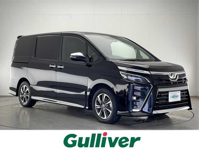 トヨタ ヴォクシー ZS 煌Ⅱ 宮崎県 2019(平31)年 5.6万km ブラック 純正SDナビ　型式NS2T-Y68T/(AM/FM/CD/DVD/BT/フルセグTV）/後席純正フリップダウンモニター/両側パワースライドドア/バックカメラ/純正アルミホイール/純正ビルトインETC/純正LEDヘッドライト/純正フォグランプ/オートライト/オートマチックハイビーム/スペアキー1本/純正サンバイザー/社外フロアマット/トヨタセーフティセンス/・衝突被害軽減ブレーキ/・横滑り防止装置/・レーンキープアシスト/・前後コーナーセンサー/・ABS/・盗難防止装置装置