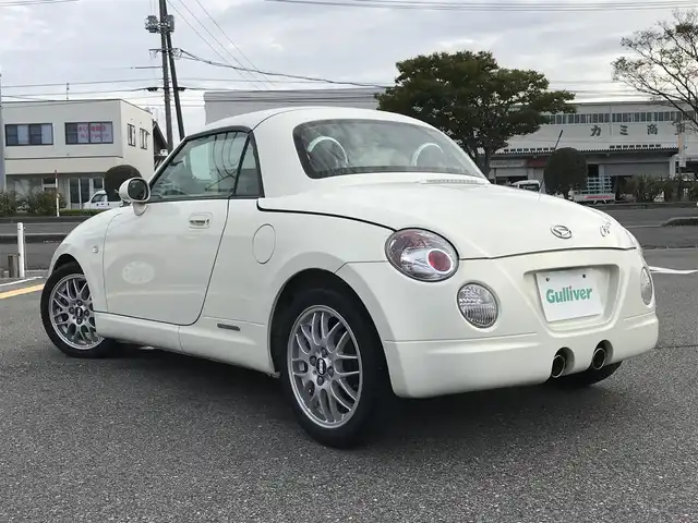 ダイハツ コペン ULTIMATE EDⅡ 鳥取県 2007(平19)年 9.6万km ホワイトパールマイカ ターボ車/電動オープン/純正ディスプレイオーディオ/CD/DVD/BT/社外ETC/アルカンターラレカロシート/BBS15インチアルミホイール/MOMOステアリング/ビルシュタインサスペンション/前席シートヒーター/キセノンライト/MTモード付AT/キーレスキー/スペアキー