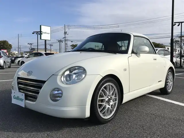ダイハツ コペン ULTIMATE EDⅡ 鳥取県 2007(平19)年 9.6万km ホワイトパールマイカ ターボ車/電動オープン/純正ディスプレイオーディオ/CD/DVD/BT/社外ETC/アルカンターラレカロシート/BBS15インチアルミホイール/MOMOステアリング/ビルシュタインサスペンション/前席シートヒーター/キセノンライト/MTモード付AT/キーレスキー/スペアキー
