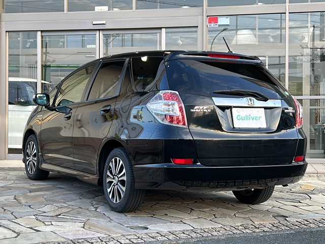 ホンダ フィット シャトル ハイブリッド スマートセレ 静岡県 2013(平25)年 10.4万km クリスタルブラックパール 純正ナビ/・FM/AM/・CD/DVD/・USB/・iPod/・SD/・Bluetooth/・ワンセグ/主要装備/・バックカメラ/・ビルトインＥＴＣ/・１５インチ純正アルミ/・横滑り防止装置/・ヒルスタートアシスト/・オートエアコン/・フォグランプ/・オートライト/・パドルシフト/・ステアリングリモコン/・ＨＩＤライト