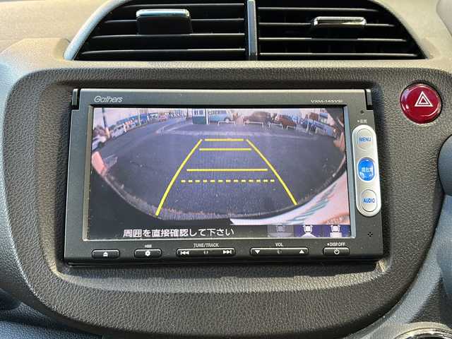 ホンダ フィット シャトル ハイブリッド スマートセレ 静岡県 2013(平25)年 10.4万km クリスタルブラックパール 純正ナビ/・FM/AM/・CD/DVD/・USB/・iPod/・SD/・Bluetooth/・ワンセグ/主要装備/・バックカメラ/・ビルトインＥＴＣ/・１５インチ純正アルミ/・横滑り防止装置/・ヒルスタートアシスト/・オートエアコン/・フォグランプ/・オートライト/・パドルシフト/・ステアリングリモコン/・ＨＩＤライト