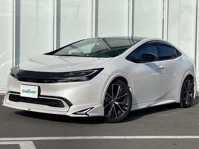 トヨタ プリウス Z 神奈川県 2023(令5)年 1.2万km プラチナホワイトパールマイカ パノラマルーフ/モデリスタフルエアロ/全方位カメラ/純正１２インチナビ/フルセグ/Bluetooth/デジタルインナーミラー/ETC2.0/追従式クルーズコントロール/純正ドライブレコーダー/パワーシート/前席シートヒーター/パーキングアシスト/ステアリングヒーター/レーンキープアシスト/衝突被害軽減システム/盗難防止装置/オートマチックハイビーム/オートライト/スペアキー