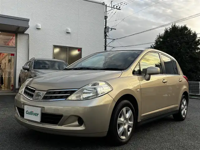 日産 ティーダ 15M SV +プラズマ 熊本県 2012(平24)年 7.4万km シルキーベージュ 純正7インチナビ(MP311D-A)/【ワンセグTV/Bluetooth/DVD/CD】/オートライト/ETC/純正フロアマット/取扱説明書