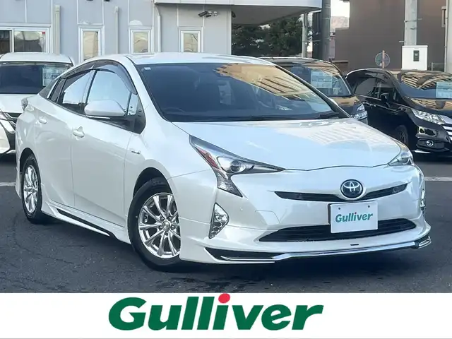 トヨタ プリウス Sセーフティプラス 島根県 2017(平29)年 7.2万km ホワイトパールクリスタルシャイン 純正アルパイン製９型メモリナビ　/フルセグＴＶ・ＤＶＤ再生・Ｂｌｕｅｔｏｏｔｈ接続　/バックカメラ　/ビルトインＥＴＣ　/モデリスタフルエアロ/ヘッドアップディプレイ/クルーズコントロール/衝突被害軽減ブレーキ　/レーンキープアシスト/前後コーナーセンサー/横滑り防止装置　/純正LEDヘッドライト/アイドリングストップ/スマートキー/プッシュスタート/社外15インチアルミホイール/純正フロアマット