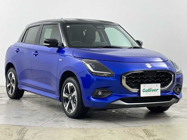 スズキ スイフト HYBRID MZ 道央・札幌 2023(令5)年 0.4万km キャラバンアイボリーパールM / シルバー2トーン ・４ＷＤ　/スズキセーフティサポート/・デュアルセンサーブレーキサポート２　/・ブラインドスポットモニター/・ドライバーモニタリングシステム/・アダプティブクルーズコントロール/・純正9インチメモリーナビゲーション/・CD/DVD/BT/フルセグTV/・スズキコネクト　/・バックカメラ/全方位カメラ　/・オートクルーズコントロール　/・シートヒーター＆リヤヒーターダクト/・マニュアルモード付パドルシフト/・アダプティブハイビームシステム/・オートライト/ＬＥＤライト/プレミアムUV＆IRカットガラス