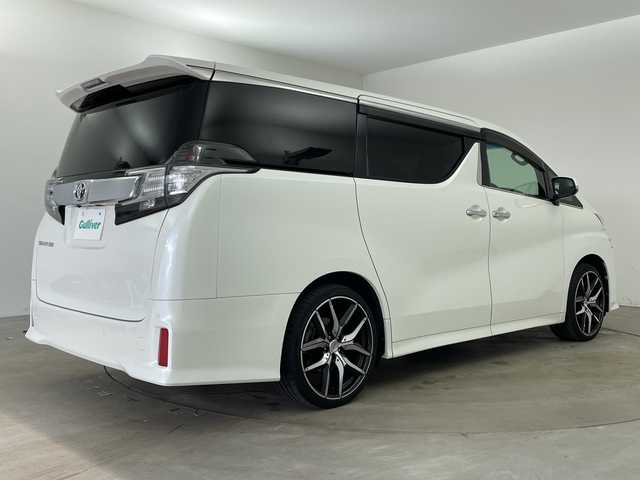 トヨタ ヴェルファイア Z 兵庫県 2015(平27)年 6.9万km ホワイトパールクリスタルシャイン ・純正9インチナビ（CD/DVD/SD/TV/BT)/・純正フリップダウンモニター/・バックカメラ/・ビルトインETC/・純正前方ドライブレコーダー/・両側パワースライドドア/・オートライト/・LEDライト/・社外20インチアルミホイール/・純正アルミホイール4本積み込み/・スマートキー/・プッシュスタート