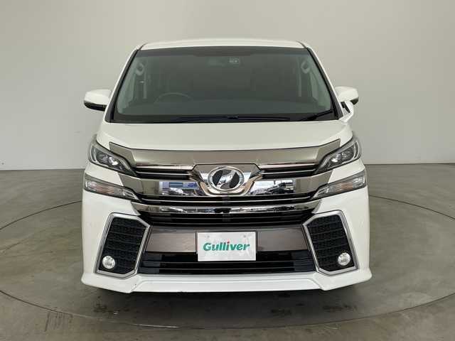 トヨタ ヴェルファイア Z 兵庫県 2015(平27)年 6.9万km ホワイトパールクリスタルシャイン ・純正9インチナビ（CD/DVD/SD/TV/BT)/・純正フリップダウンモニター/・バックカメラ/・ビルトインETC/・純正前方ドライブレコーダー/・両側パワースライドドア/・オートライト/・LEDライト/・社外20インチアルミホイール/・純正アルミホイール4本積み込み/・スマートキー/・プッシュスタート