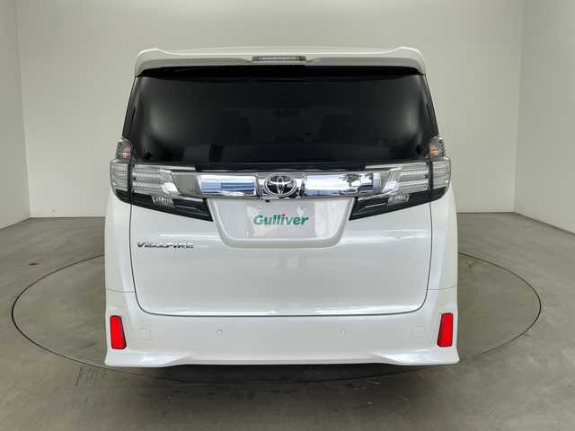 トヨタ ヴェルファイア Z 兵庫県 2015(平27)年 6.9万km ホワイトパールクリスタルシャイン ・純正9インチナビ（CD/DVD/SD/TV/BT)/・純正フリップダウンモニター/・バックカメラ/・ビルトインETC/・純正前方ドライブレコーダー/・両側パワースライドドア/・オートライト/・LEDライト/・社外20インチアルミホイール/・純正アルミホイール4本積み込み/・スマートキー/・プッシュスタート