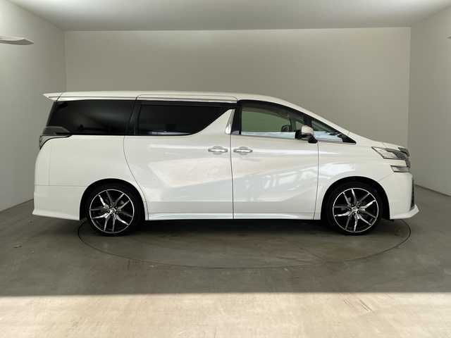 トヨタ ヴェルファイア Z 兵庫県 2015(平27)年 6.9万km ホワイトパールクリスタルシャイン ・純正9インチナビ（CD/DVD/SD/TV/BT)/・純正フリップダウンモニター/・バックカメラ/・ビルトインETC/・純正前方ドライブレコーダー/・両側パワースライドドア/・オートライト/・LEDライト/・社外20インチアルミホイール/・純正アルミホイール4本積み込み/・スマートキー/・プッシュスタート