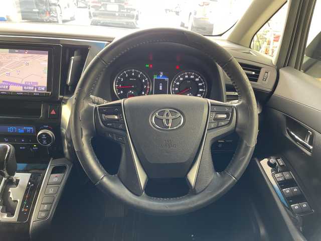 トヨタ ヴェルファイア Z 兵庫県 2015(平27)年 6.9万km ホワイトパールクリスタルシャイン ・純正9インチナビ（CD/DVD/SD/TV/BT)/・純正フリップダウンモニター/・バックカメラ/・ビルトインETC/・純正前方ドライブレコーダー/・両側パワースライドドア/・オートライト/・LEDライト/・社外20インチアルミホイール/・純正アルミホイール4本積み込み/・スマートキー/・プッシュスタート