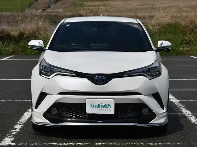 トヨタ Ｃ－ＨＲ G LEDエディション 福岡県 2018(平30)年 2万km ホワイトパールクリスタルシャイン モデリスタフルエアロ/TRDマッドフラップ/純正9インチメモリナビ【NSZT-Y66T】/フルセグTV・BT・CD・DVD・HDMI・FM・AM/バック/フロントカメラ/ETC/レーダークルーズコントロール/プリクラッシュセーフティ/レーンディパーチャーアラート/オートマチックハイビーム/ブラインドスポットモニター/クリアランスソナー/ブレーキホールド/シーケンシャルウインカー/純正LEDヘッドライト/ハーフレザーシート/シートヒーター/革巻きステアリング/保証書・取説・スペアキー