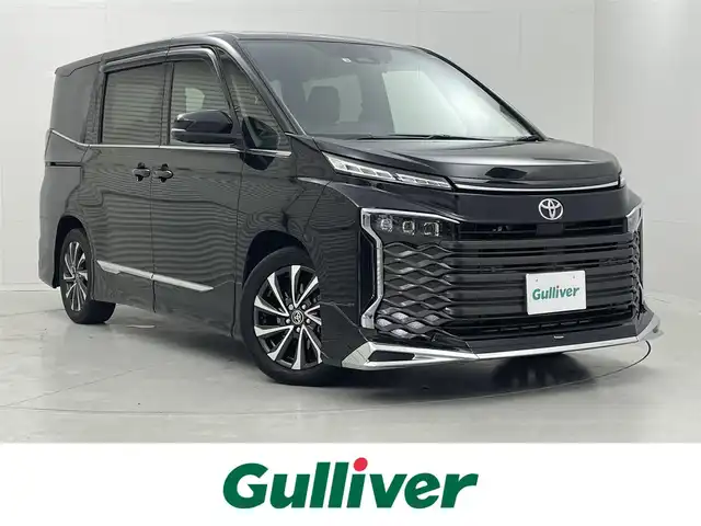 トヨタ ヴォクシー S－Z 茨城県 2022(令4)年 1.6万km アティチュードブラックマイカ 純正10.5型DA/ナビキット/全方位カメラ/フルセグ/アドバンストパーク/モデリスタエアロ/快適利便パッケージ/ユニバーサルステップ/衝突被害軽減ブレーキ/車線逸脱抑制装置/レーダークルーズコントロール/BSM/オートマチックハイビーム/クリアランスソナー/両側電動スライドドア/ETC2.0/ドラレコ/シートヒーター/純正18インチAW/3眼LEDヘッドライト/スマートキー