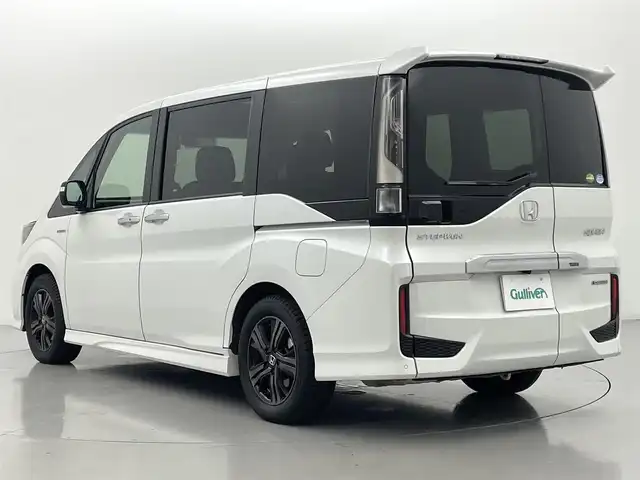 ホンダ ステップワゴン スパーダ ハイブリッド G EX ホンダセンシング 熊本県 2019(令1)年 6.7万km プラチナホワイトパール ワンオーナー　/禁煙車　/社外ナビ　/カロッツェリアフリップダウンモニター　/ビルトインＥＴＣ　/社外前後ドライブレコーダー　/バックカメラ/レーダークルーズコントロール/前後クリアランスソナー　/両側パワースライドドア　/前席シートヒーター　/ＧＰＳレーダー探知機/レーンキープアシスト/横滑り防止/デジタルインナーミラー/フロアマット/純正１６インチAW/オートライト/LEDヘッドライト/フォグライト/スマートキー/プッシュスタート/保証書/取扱説明書