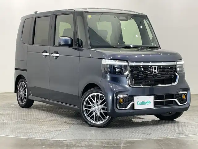 ホンダ Ｎ ＢＯＸ カスタム ターボ 栃木県 2023(令5)年 2.4万km メテオロイドグレーメタリック ターボ/純正ナビ/　（CD/DVD/フルセグTV/Bluetooth/MSV）/バックカメラ/フリップダウンモニター/ホンダセンシング/・衝突軽減ブレーキ/・誤発進抑制機能/・アダプティブクルーズコントロール/・車線維持支援システム/・路外逸脱抑制機能/・先行車発進お知らせ機能/・標識認識機能/・オートハイビーム/前後コーナーセンサー/ETC/両側パワースライドドア/ハーフレザーシート/純正AW/チップアップシート/LEDヘッドライト/サイド+カーテンエアバック