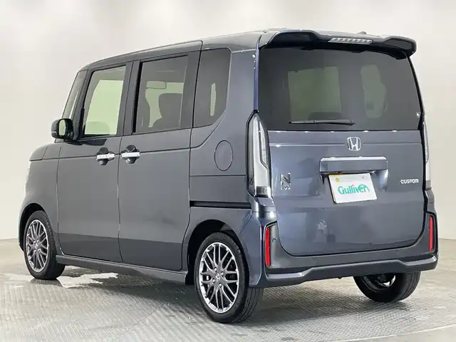 ホンダ Ｎ ＢＯＸ カスタム ターボ 栃木県 2023(令5)年 2.4万km メテオロイドグレーメタリック ターボ/純正ナビ/　（CD/DVD/フルセグTV/Bluetooth/MSV）/バックカメラ/フリップダウンモニター/ホンダセンシング/・衝突軽減ブレーキ/・誤発進抑制機能/・アダプティブクルーズコントロール/・車線維持支援システム/・路外逸脱抑制機能/・先行車発進お知らせ機能/・標識認識機能/・オートハイビーム/前後コーナーセンサー/ETC/両側パワースライドドア/ハーフレザーシート/純正AW/チップアップシート/LEDヘッドライト/サイド+カーテンエアバック
