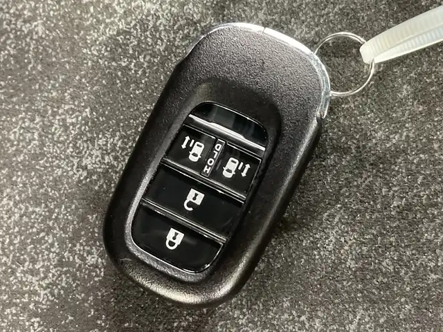 ホンダ Ｎ ＢＯＸ カスタム ターボ 栃木県 2023(令5)年 2.4万km メテオロイドグレーメタリック ターボ/純正ナビ/　（CD/DVD/フルセグTV/Bluetooth/MSV）/バックカメラ/フリップダウンモニター/ホンダセンシング/・衝突軽減ブレーキ/・誤発進抑制機能/・アダプティブクルーズコントロール/・車線維持支援システム/・路外逸脱抑制機能/・先行車発進お知らせ機能/・標識認識機能/・オートハイビーム/前後コーナーセンサー/ETC/両側パワースライドドア/ハーフレザーシート/純正AW/チップアップシート/LEDヘッドライト/サイド+カーテンエアバック