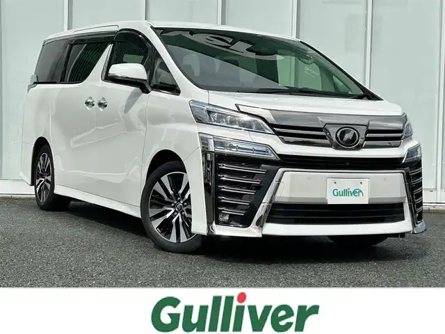 トヨタ ヴェルファイア Z Gエディション 福岡県 2018(平30)年 5.1万km ホワイトパールクリスタルシャイン MOP　JBLナビ/　（AM/FM/CD/DVD/ブルーレイ/BT/USB/AUX/SD/SD REC/フルセグ)/MOP　１３．３インチリアエンターテイメントシステム/　（HDMI付）/純正デジタルインナーミラー/BSM/RCTA/RSA/LTA/アラウンドビュー/ETC2.0/ヒートステアリング/置くだけ充電/シートヒーター（D席＋N席）/エアシート（D席＋N席）/パワーシート（１列目＋２列目）/D席メモリーシート/サンシェード/ISOFIX/純正バイザー/オート電格ミラー/DUALオートAAC/フォグランプ/LEDライト/純正マット