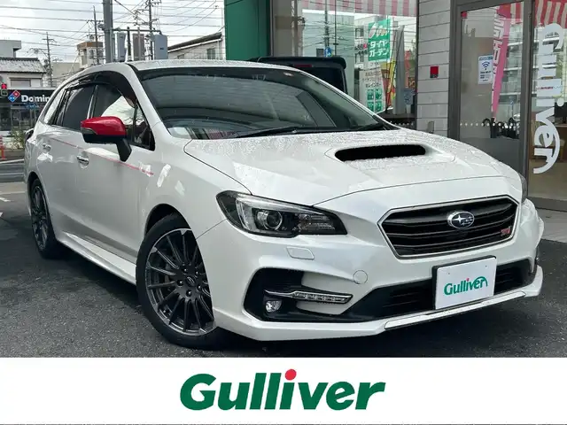 スバル レヴォーグ 2．0STIスポーツアイサイト 愛知県 2018(平30)年 3.5万km クリスタルホワイトP ワンオーナー/４WD/純正BILSTEIN製ダンパー/社外スポーツマフラー〈HKS〉/ボルドー＆ブラックレザーシート/前席パワーシート〈運転席メモリ付〉/前席シートヒーター/純正DIATONESOUNDナビ/・DVD／Bluetooth／地デジTV/バックカメラ/社外スピーカー〈KENWOOD製〉/デジタルインナーミラー/社外ミラーカバー/社外サブウーファ―〈Carrozzeria〉/LEDヘッドライト＆フォグランプ/リアフォグランプ/純正18インチAW/・タイヤ：ミシュラン パイロットスポーツ５/STIロゴ入りステンレス製スカッフプレート/アイサイトツーリングアシスト/・プリクラッシュセーフティ/・後退時自動ブレーキシステム/・車線逸脱警報機能/・誤発進抑制制御/・誤後進抑制制御/・全車速追従型レーダークルーズコントロール/・ツーリングアシスト/・アイサイトアシストモニター/アイサイトセィフティプラス/・リアビークルディテクション/・ハイビームアシスト/・フロント／サイドビューカメラ/・スマートリアビューカメラ/スマートキー＆プッシュスタート