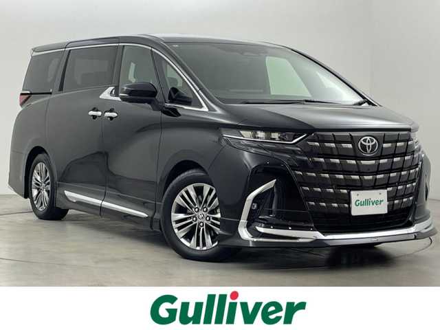 トヨタ アルファードハイブリット Z 福岡県 2024(令6)年 0.7万km ブラック 左右独立ムーンルーフ　/モデリスタエアロ／マフラー　/純正１４型ＤＡナビ／フルセグTV　/全方位カメラ　/ワイヤレス充電　/デジタルルームミラー　/ビルトインETC２．０　/ユニバーサルステップ　/トヨタセーフティセンス　/レーダークルーズコントロール　/コーナーセンサー　/衝突軽減ブレーキ　/レーンキープ　/ブラインドスポットモニター　/アクセル踏み間違い防止　/チームメイトアドバンストパーク　/両側電動スライドドア　/パワーバックドア　/シートベンチレーション／ヒーター　/ステアリングヒーター　/３眼ＬＥＤヘッドライト　/純正１８インチアルミホイール
