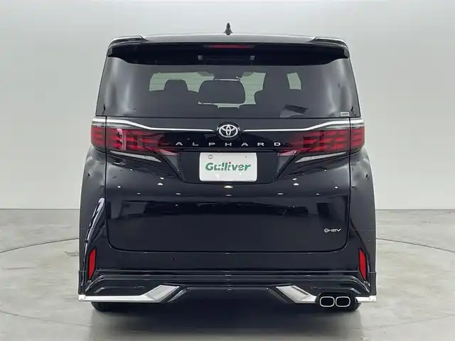 トヨタ アルファードハイブリット Z 福岡県 2024(令6)年 0.7万km ブラック 左右独立ムーンルーフ　/モデリスタエアロ／マフラー　/純正１４型ＤＡナビ／フルセグTV　/全方位カメラ　/ワイヤレス充電　/デジタルルームミラー　/ビルトインETC２．０　/ユニバーサルステップ　/トヨタセーフティセンス　/レーダークルーズコントロール　/コーナーセンサー　/衝突軽減ブレーキ　/レーンキープ　/ブラインドスポットモニター　/アクセル踏み間違い防止　/チームメイトアドバンストパーク　/両側電動スライドドア　/パワーバックドア　/シートベンチレーション／ヒーター　/ステアリングヒーター　/３眼ＬＥＤヘッドライト　/純正１８インチアルミホイール