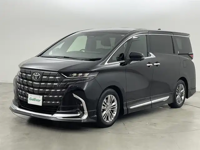 トヨタ アルファードハイブリット Z 福岡県 2024(令6)年 0.7万km ブラック 左右独立ムーンルーフ　/モデリスタエアロ／マフラー　/純正１４型ＤＡナビ／フルセグTV　/全方位カメラ　/ワイヤレス充電　/デジタルルームミラー　/ビルトインETC２．０　/ユニバーサルステップ　/トヨタセーフティセンス　/レーダークルーズコントロール　/コーナーセンサー　/衝突軽減ブレーキ　/レーンキープ　/ブラインドスポットモニター　/アクセル踏み間違い防止　/チームメイトアドバンストパーク　/両側電動スライドドア　/パワーバックドア　/シートベンチレーション／ヒーター　/ステアリングヒーター　/３眼ＬＥＤヘッドライト　/純正１８インチアルミホイール